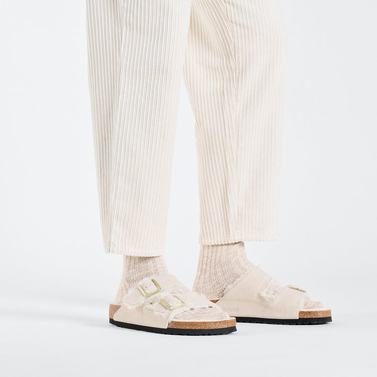 Birkenstock Arizona Shearling Antique White Suede Leather Shearling on model 1