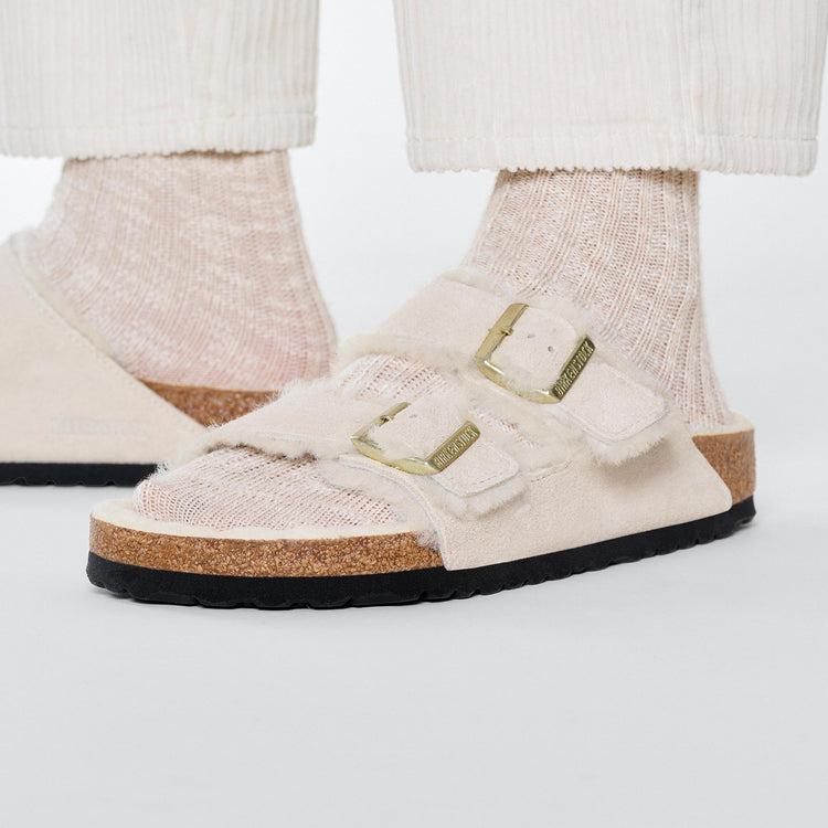 Birkenstock Arizona Shearling Antique White Suede Leather Shearling on model 2