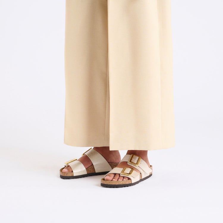 Birkenstock Sydney Cushion Buckle Graceful Pearl White Birko Flor on model 1
