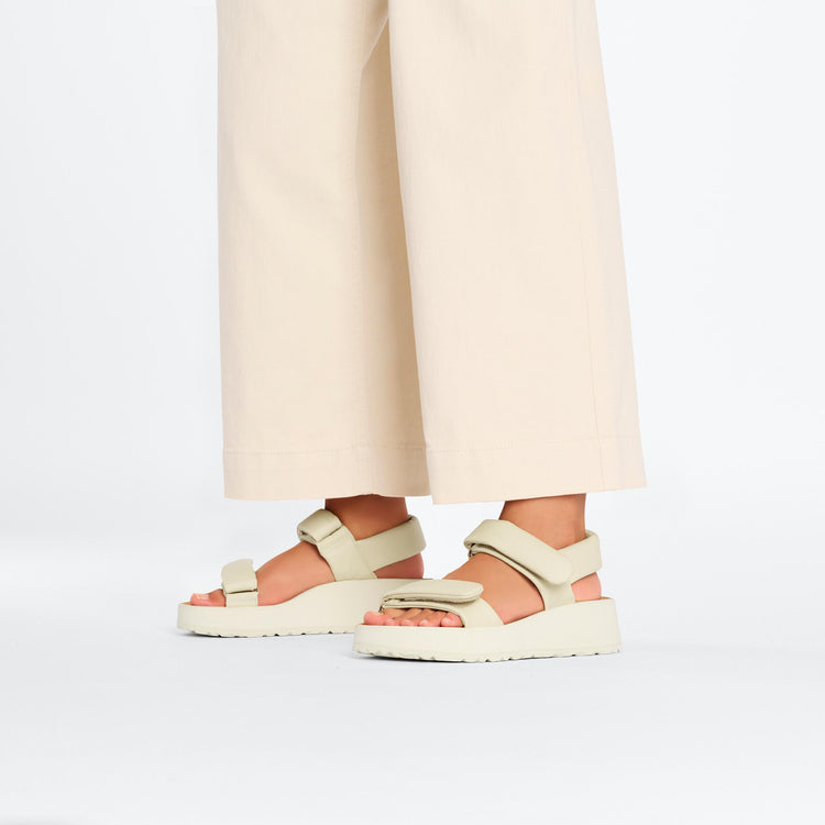 Birkenstock Theda Exquisite Platform Wedge Ecru Smooth Leather on model 1