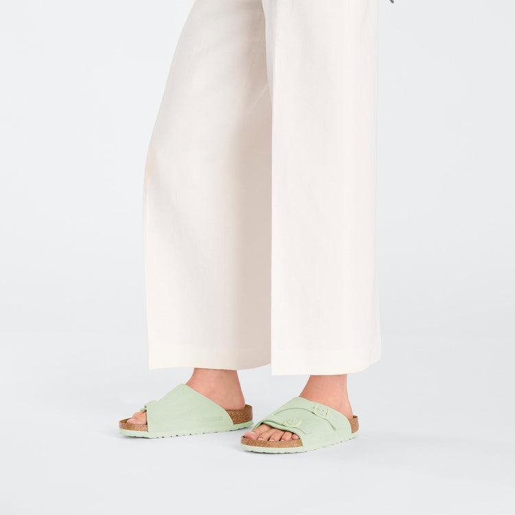 Birkenstock Zurich Faded Lime Suede Leather on model 1