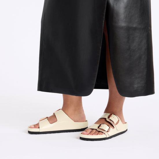 Birkenstock Arizona Big Buckle Exquisite High Shine Ecru Natural Leather Patent on model