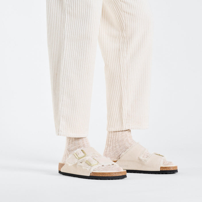 Birkenstock Arizona Shearling Antique White Suede Leather Shearling on model 1