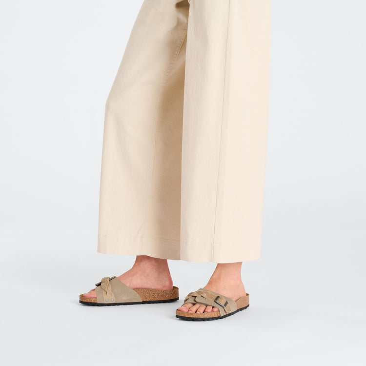 Birkenstock Oita Braided Taupe Suede Leather on model 1