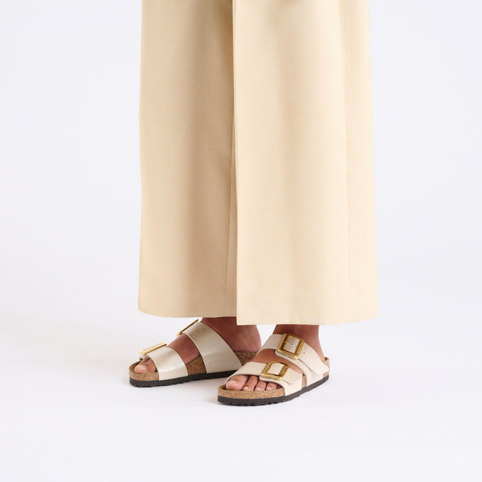 Birkenstock Sydney Cushion Buckle Graceful Pearl White Birko Flor on model 1