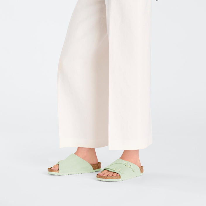 Birkenstock Zurich Faded Lime Suede Leather on model 1